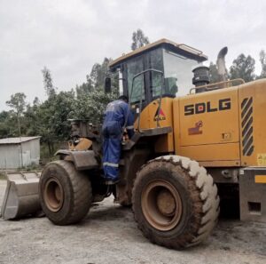 fuel monitoring installation team of walta technologies installing fuel sensor on loader 2