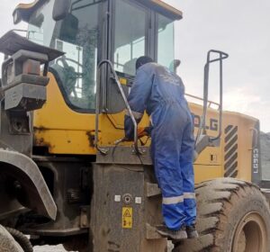 fuel monitoring installation team of walta technologies installing fuel sensor on loader