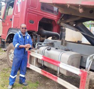 hawassa fuel monitoring technicans installing fuel sensor on dump truck