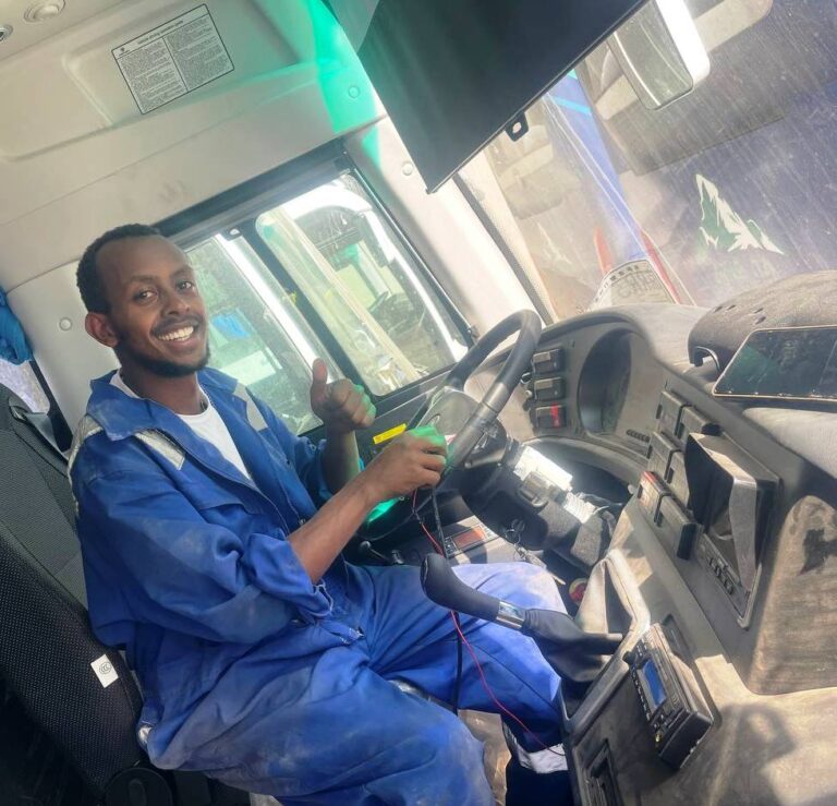 soloda bus our fuel monitoring technicans connecting fuel sensor wire with gps tracker on the buses