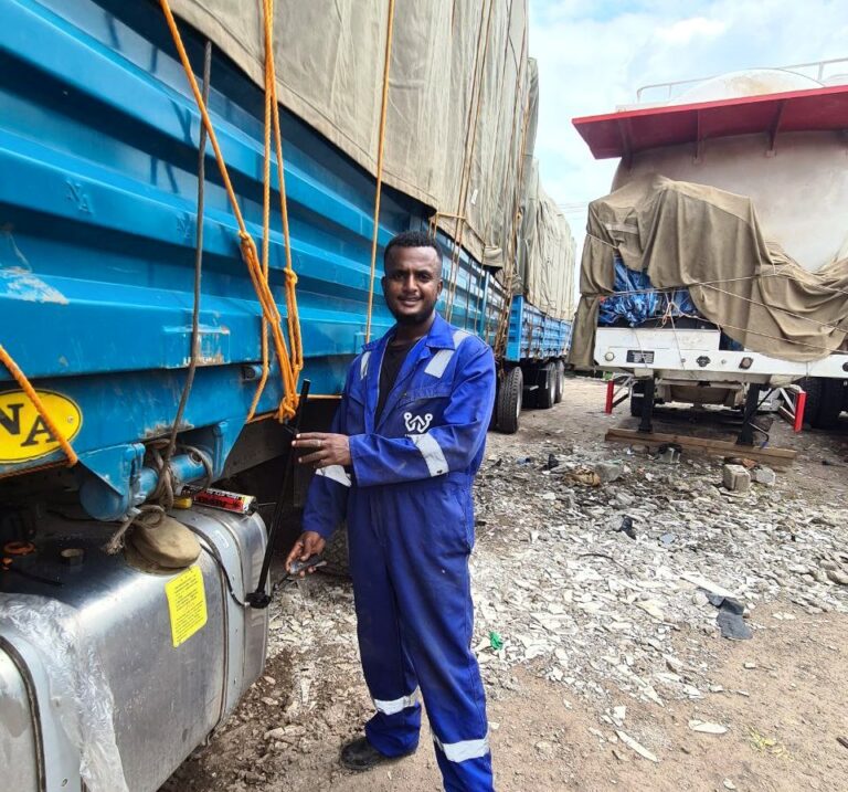 walta technologies fuel monitoring technicans installing fuel sensor on trucks