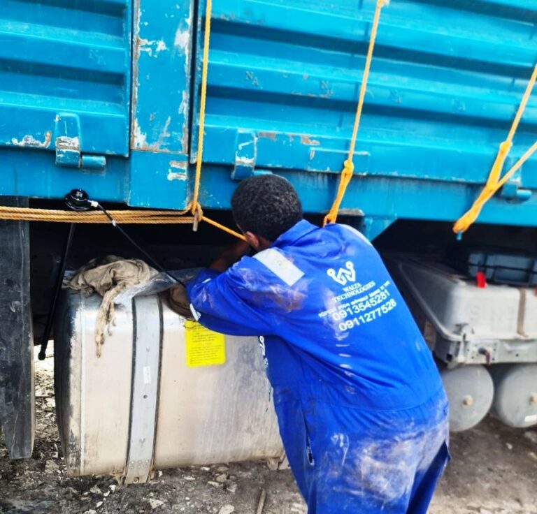 walta technologies technicans installing fuel sensor for trucks
